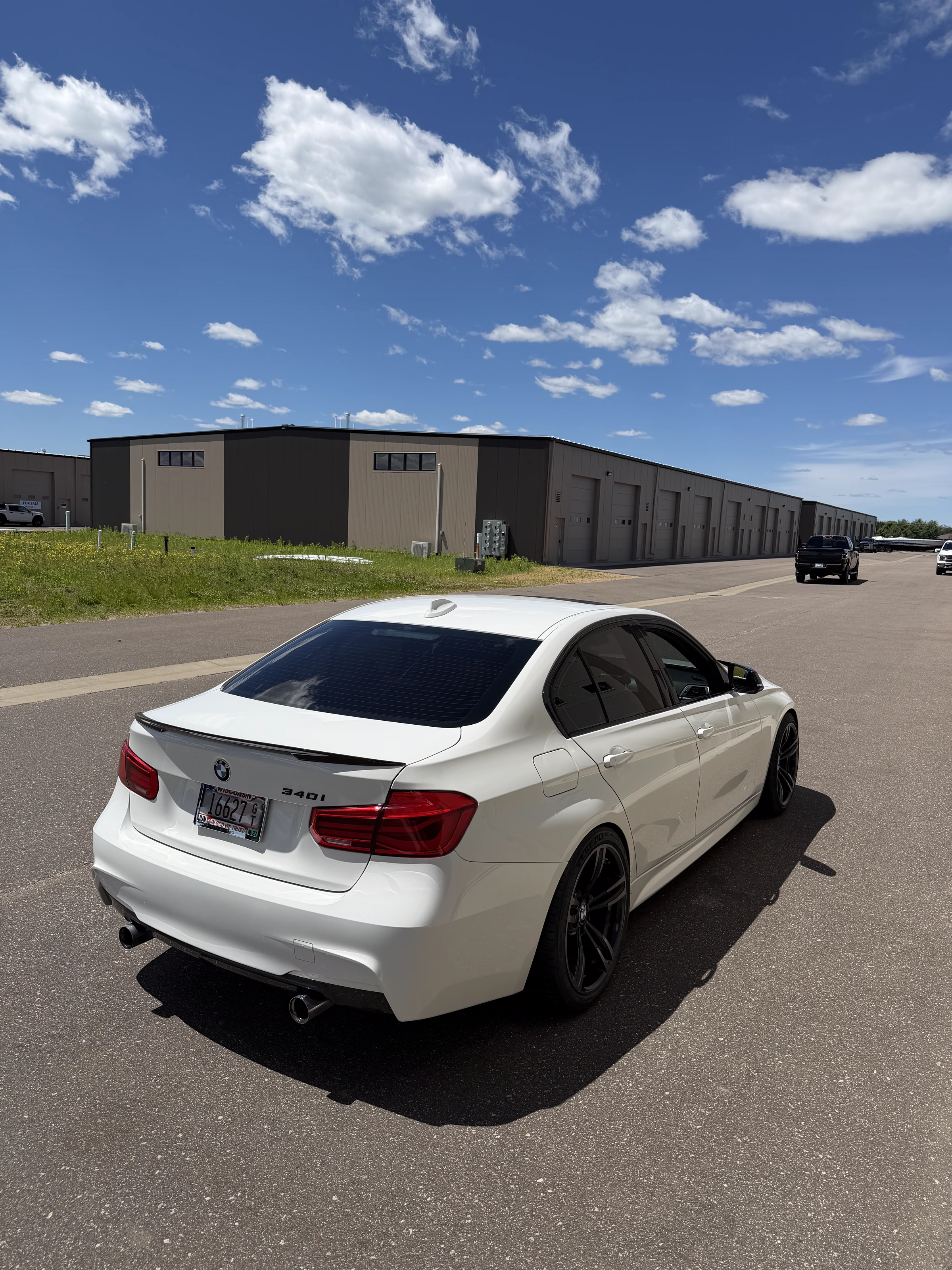 White BMW 340i outside The Upgrade Shop in River Falls