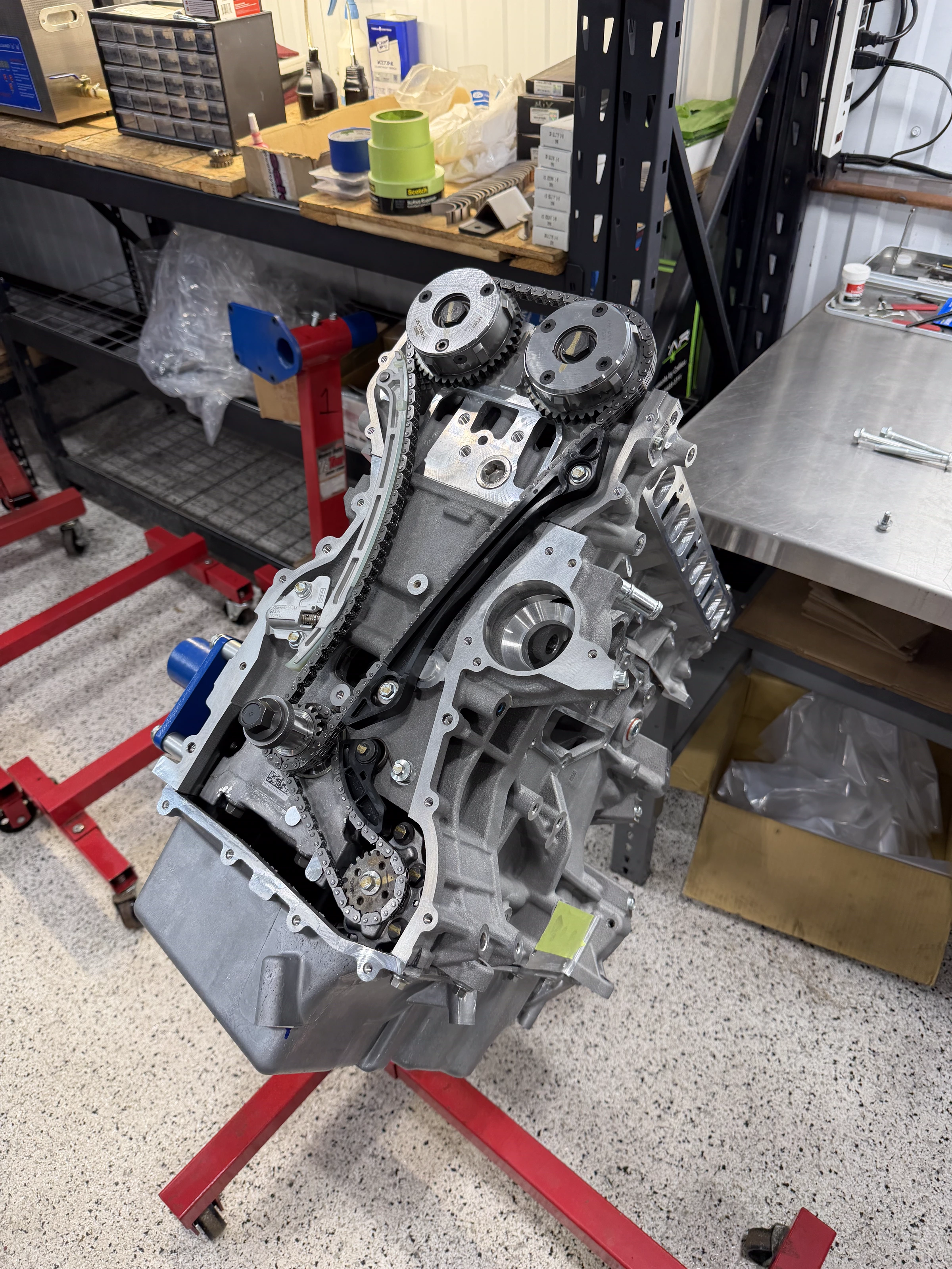 Engine on a stand with timing chain assembly at The Upgrade Shop
